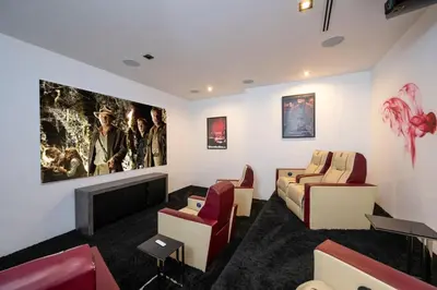 a waiting room with chairs and a fireplace at Sunset Plaza Ultra Modern Home in Los Angeles