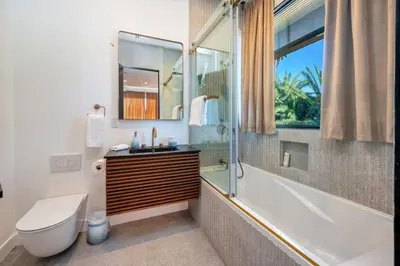 a bathroom with a tub and a toilet and a sink at Luxury 6BR Beverly Hills Villa with Pool and Views in Los Angeles