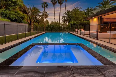 a swimming pool in the backyard of a house at Luxury 6BR Beverly Hills Villa with Pool and Views in Los Angeles