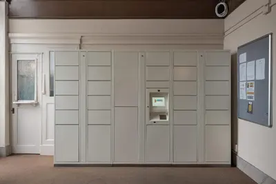a room with a large white cabinet with a machine at Ocean-View 1BR Condo in Historic Cooper Arms in Long Beach