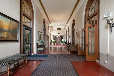 a hallway of a building with a hallwayngth at Ocean-View 1BR Condo in Historic Cooper Arms in Long Beach