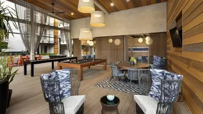 a living room with a pool table and a billiards at Sapphire Marina - Marina View Pool, Gym, Game Room in Los Angeles