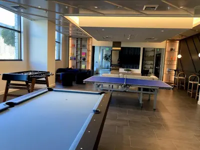 a billiard room with two ping pong tables at DTLA Luxury Studio in Los Angeles