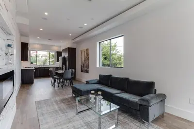 a living room with a couch and a table at Luxury Modern 4 Bed 4 Bath Home with Rooftop Deck #6 in Los Angeles