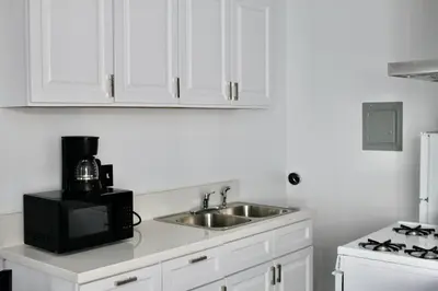 a kitchen with a sink and a microwave at SMA Apartment in Los Angeles