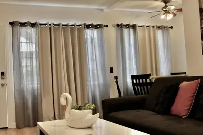 a living room with a couch and a table at SMA Apartment in Los Angeles