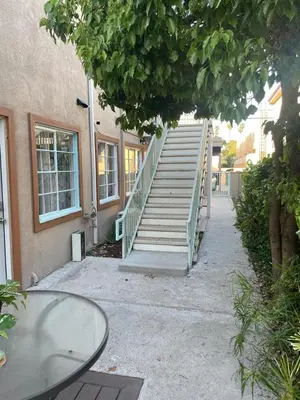 a set of stairs leading to a building with a table at SMA Apartment in Los Angeles
