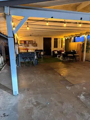 an empty garage with lights on top of it at Cozy Private Room Near Disneyland, Beaches & Downtown LA in Artesia