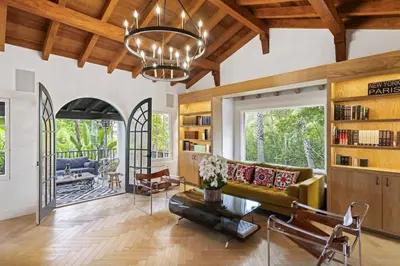 a living room with a couch and a chandelier at One of Kind Ultra Luxury Beverly Hills Estate in Los Angeles