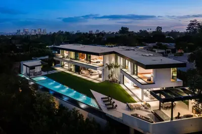 an aerial view of a house with a swimming pool at Luxurious 5BR Villa in BH with Pool, Theater, and Views in Los Angeles
