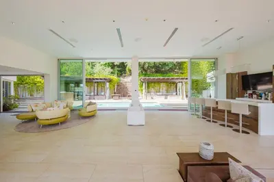 an open living room with a lot of windows at Beverly Hills Ultra Luxury Villa with Pool and Theatre in Beverly Hills