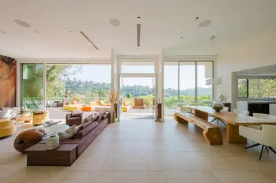 a living room with a couch and a table at Beverly Hills Ultra Luxury Villa with Pool and Theatre in Beverly Hills