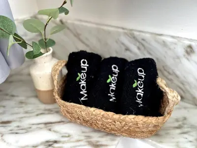 two black towels in a basket on a counter at Pool House Retreat near LAX, SoFi & Beach in Inglewood