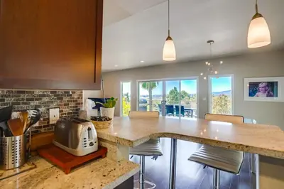 a kitchen with a counter with a toaster on it at LA Chic Stunning Views & Sunsets in Los Angeles