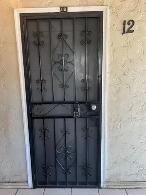 a black door to a building with the number twelve at Comfy Studio Near Downtown LA with AC WiFi and Snacks in Los Angeles
