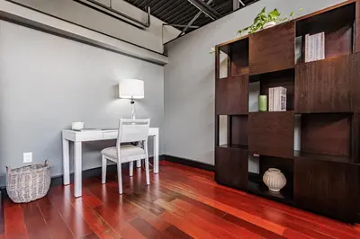 a dining room with a table and a book shelf at Long Beach Apartment - 10 Min Walk to the Beach! in Long Beach