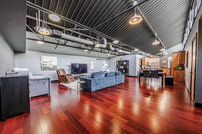 a living room with blue couches and a table at Long Beach Apartment - 10 Min Walk to the Beach! in Long Beach