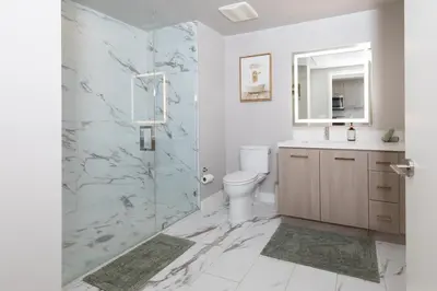 a bathroom with a shower and a toilet and a sink at Beautiful NEW apartment in SM! in Los Angeles