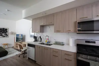 a kitchen with a sink and a stove top oven at Beautiful NEW apartment in SM! in Los Angeles