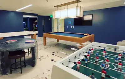 a room with a ping pong table and a pool table at Beautiful NEW apartment in SM! in Los Angeles