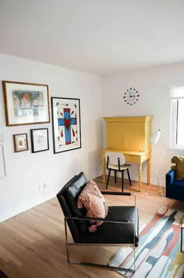 a living room with a chair and a desk at Lalaland Bungalow in Burbank