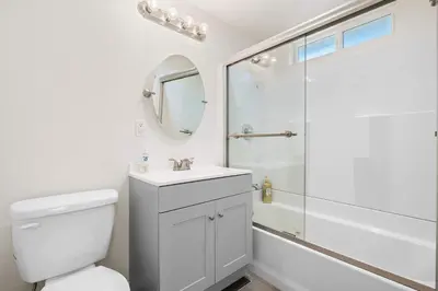 a bathroom with a white toilet and a shower at Foothills LA Hideaway Patio Lounge Work-Friendly in Glendora