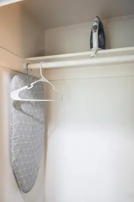 a tie hanging on a rack in a closet at Foothills LA Hideaway Patio Lounge Work-Friendly in Glendora