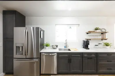 a kitchen with a stainless steel refrigerator at Bear Mountain Getaway in Big Bear Lake