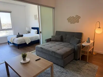 a living room with a couch and a bed at Cozy Beachside Escape with Great Views in Long Beach