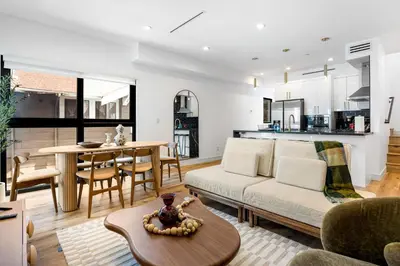 a living room with a couch and a table at Luna View LA in Los Angeles