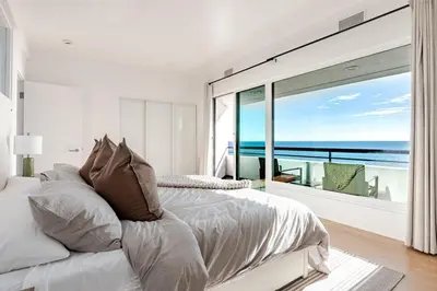a bedroom with a bed with a view of the ocean at Gorgeous Malibu Retreat with #Instaworthy Ocean Views in Malibu Beach