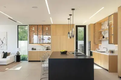 a kitchen with a black island in a room at Luxurious Malibu 6BR Estate with Pool, Theatre, Views in Malibu Beach