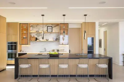 a kitchen with a island with chairs around it at Luxurious Malibu 6BR Estate with Pool, Theatre, Views in Malibu Beach