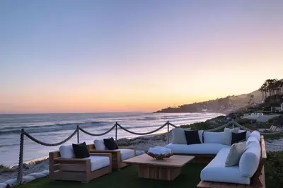 a living room with couches and a view of the ocean at Luxury Beachfront Villa W. Stunning Pacific Views in Malibu