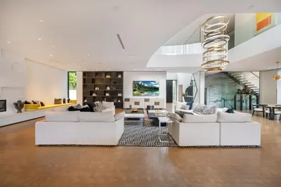 a living room with white couches and a dining room at Ultra Luxurious Villa in the Beverly Hills Flats in Los Angeles