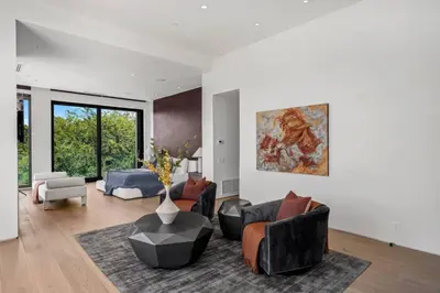 a living room with couches and a table at Prestigious 6BR BH Mansion W. Pool, Theatre, Views in Los Angeles