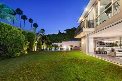 an exterior view of a house with a large yard at Royalty Villa in Beverly Hills in Los Angeles