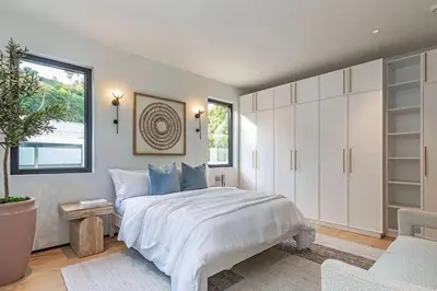 a bedroom with a large white bed and a window at Sunset Plaza Luxury Masterpiece Villa in Los Angeles