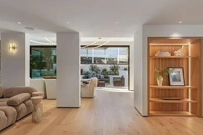 a living room with a couch and a table at Sunset Plaza Luxury Masterpiece Villa in Los Angeles