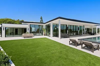 a house with a pool and a lawn at Ultra Luxurious 5BR Villa W. Pool, Jacuzzi, Views in Los Angeles