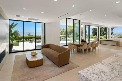 a living room with a couch and a table at Ultra Luxurious 5BR Villa W. Pool, Jacuzzi, Views in Los Angeles