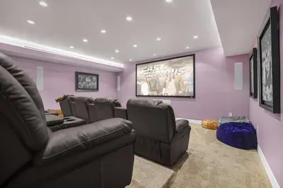 a movie room with a bunch of chairs and a couch at Prestigious Hillside Villa W. Pool, Theater, Views in Los Angeles