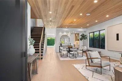 a living room with a staircase and a dining room at Stunning 5BR in Studio City W. Pool, and Jacuzzi in Los Angeles