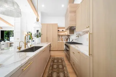 a kitchen with white cabinets and a sink at Stunning 6BR Laurel Canyon Estate with Pool and Jacuzzi in Los Angeles