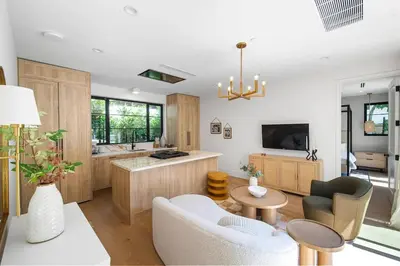 a living room with a couch and a table at Stunning 6BR Laurel Canyon Estate with Pool and Jacuzzi in Los Angeles