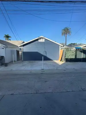 a white house with a ramp in a driveway at 262 Coronado ave in Long Beach