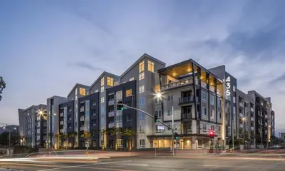 a large building on a city street at night at Modern Serenity Apartment for a Comfortable Stay in Glendale