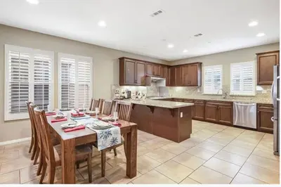 a kitchen with a table with chairs and a dining room at Shopping at Arcadia Mall, Homes, School District, Comfortable Home on Huntington Road in Arcadia