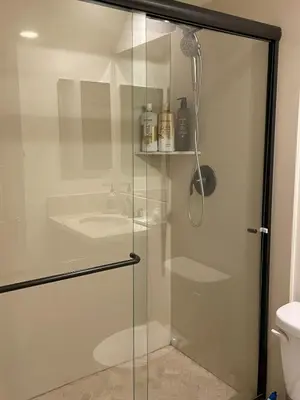 a shower with a glass door in a bathroom at Shopping at Arcadia Mall, Homes, School District, Comfortable Home on Huntington Road in Arcadia