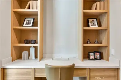 a room with a desk with a chair and shelves at Studio City Luxury 6BR Home with Pool and Theatre in Los Angeles